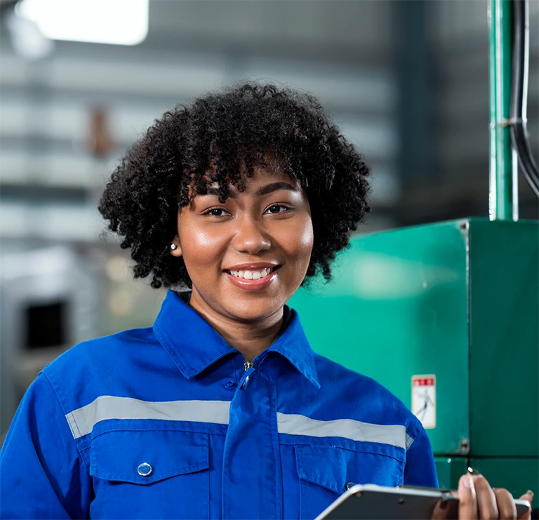 Smiling black woman holding a pen and a note tab